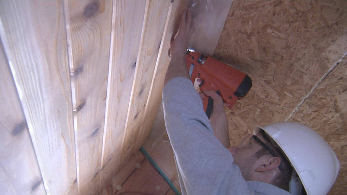 Man working on inside roof