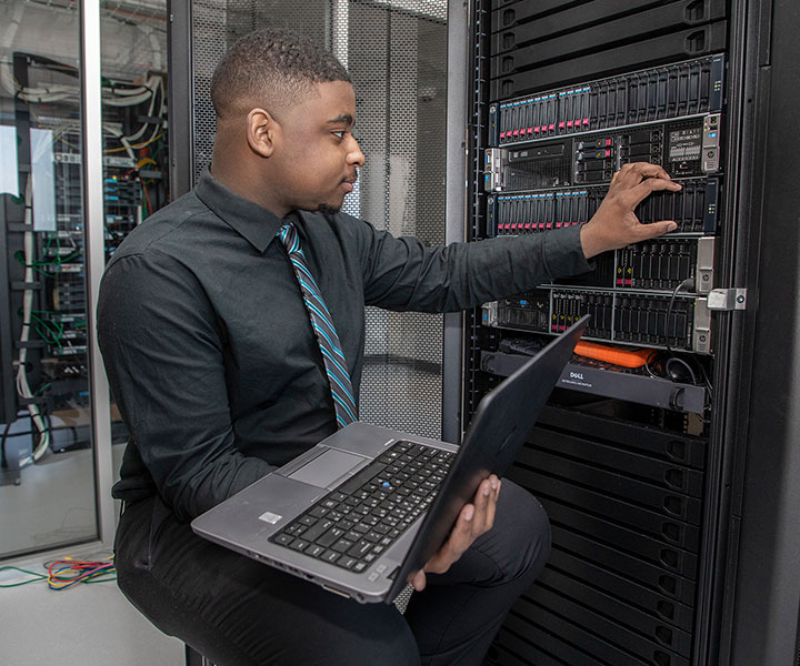 Person working on computer servers