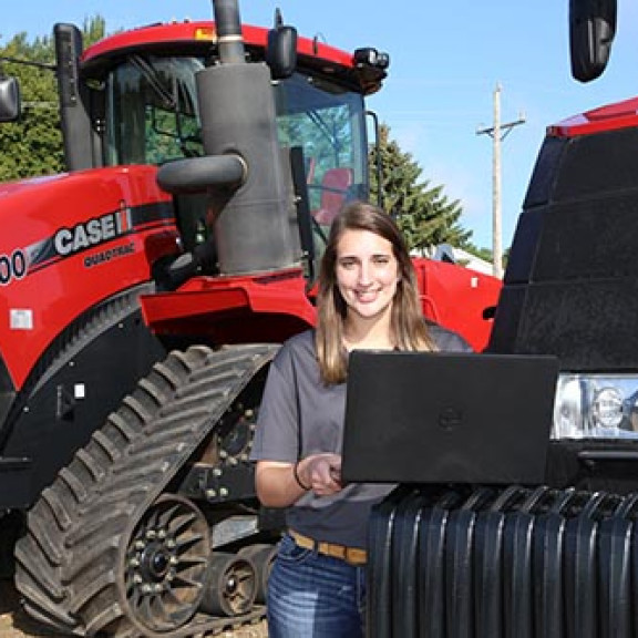 Student working on tractors