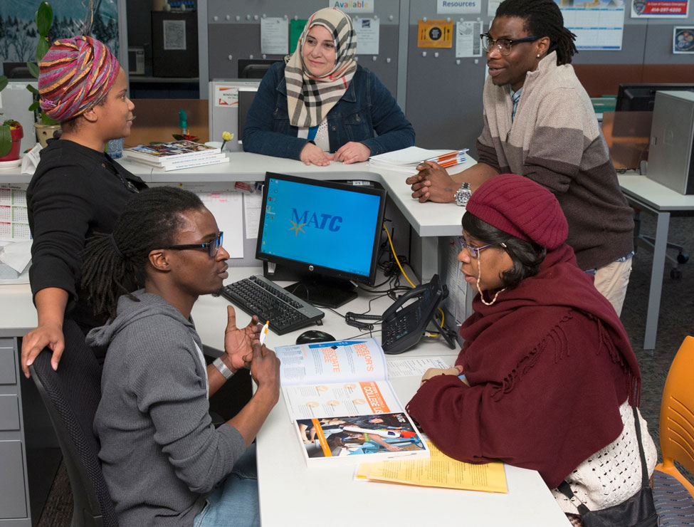 BIPOC students and staff chatting in campus office
