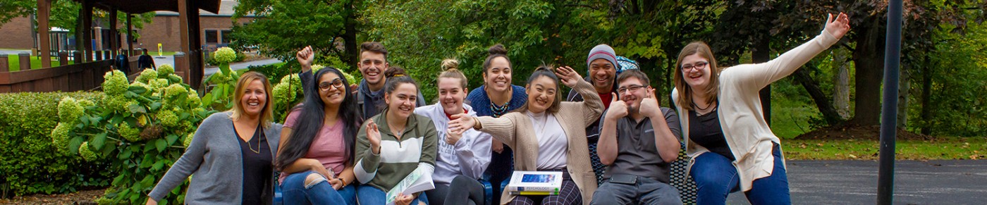 Group of students smiling together on campus