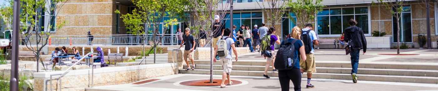 Madison College entrance with students walking