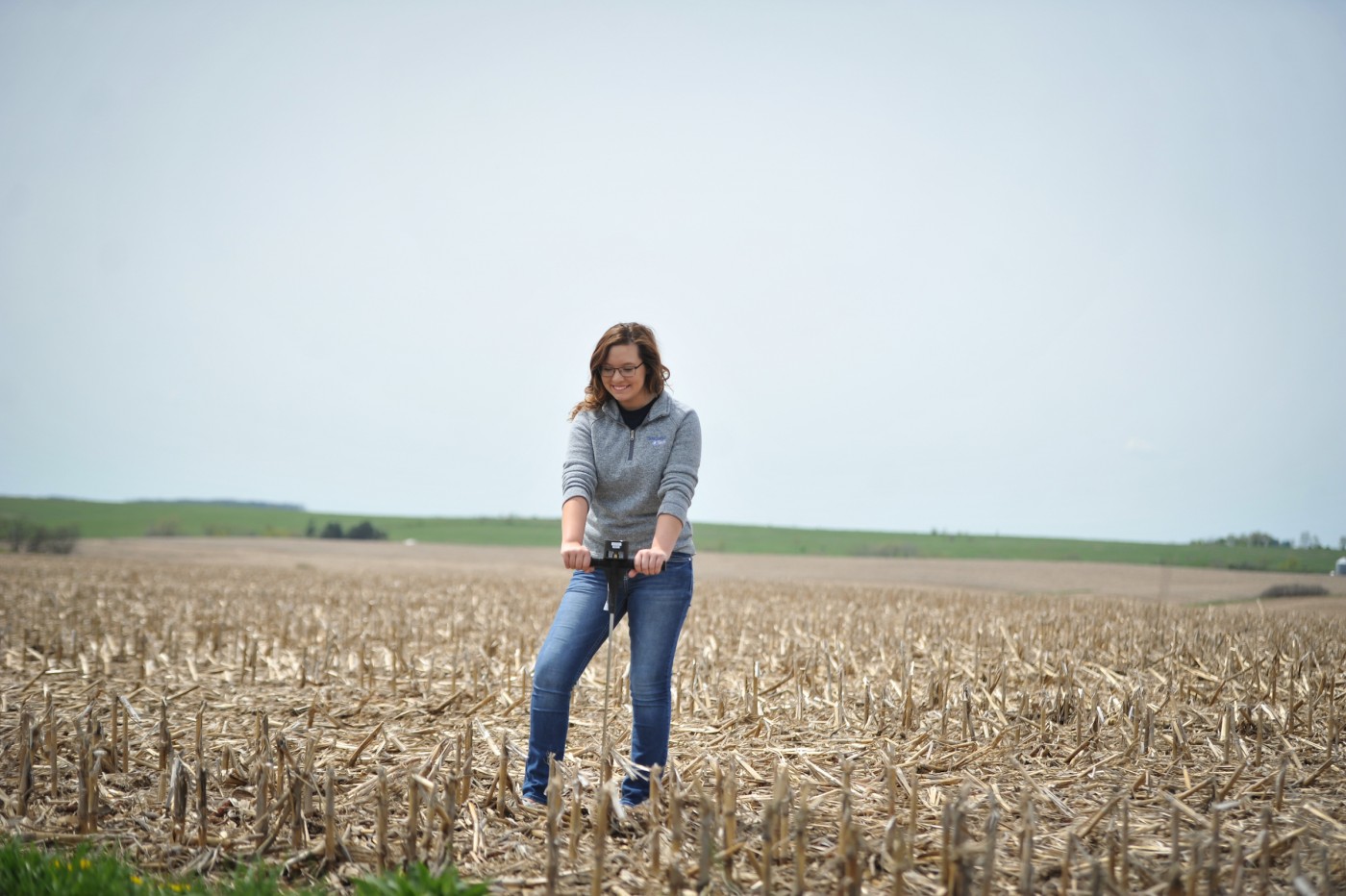 Ag student in dried corn field