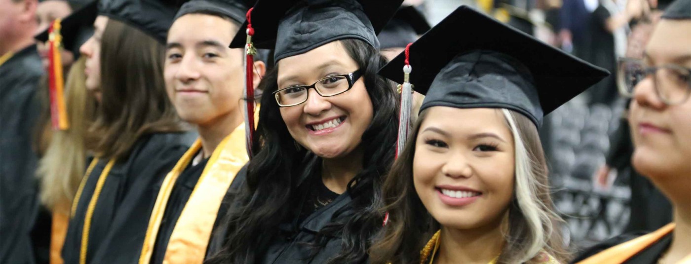 Three Fox Valley graduates at graduation ceremony