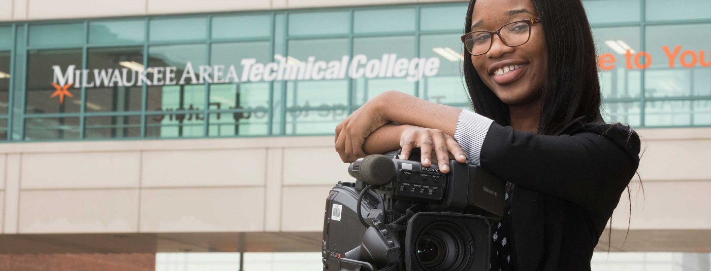 Visual Communications student with professional camera
