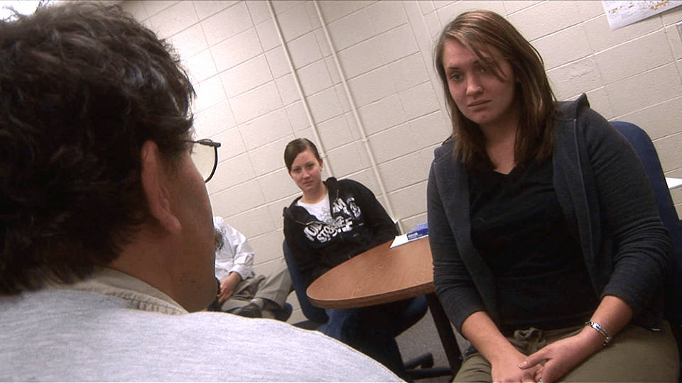 students observing a simulated counseling session