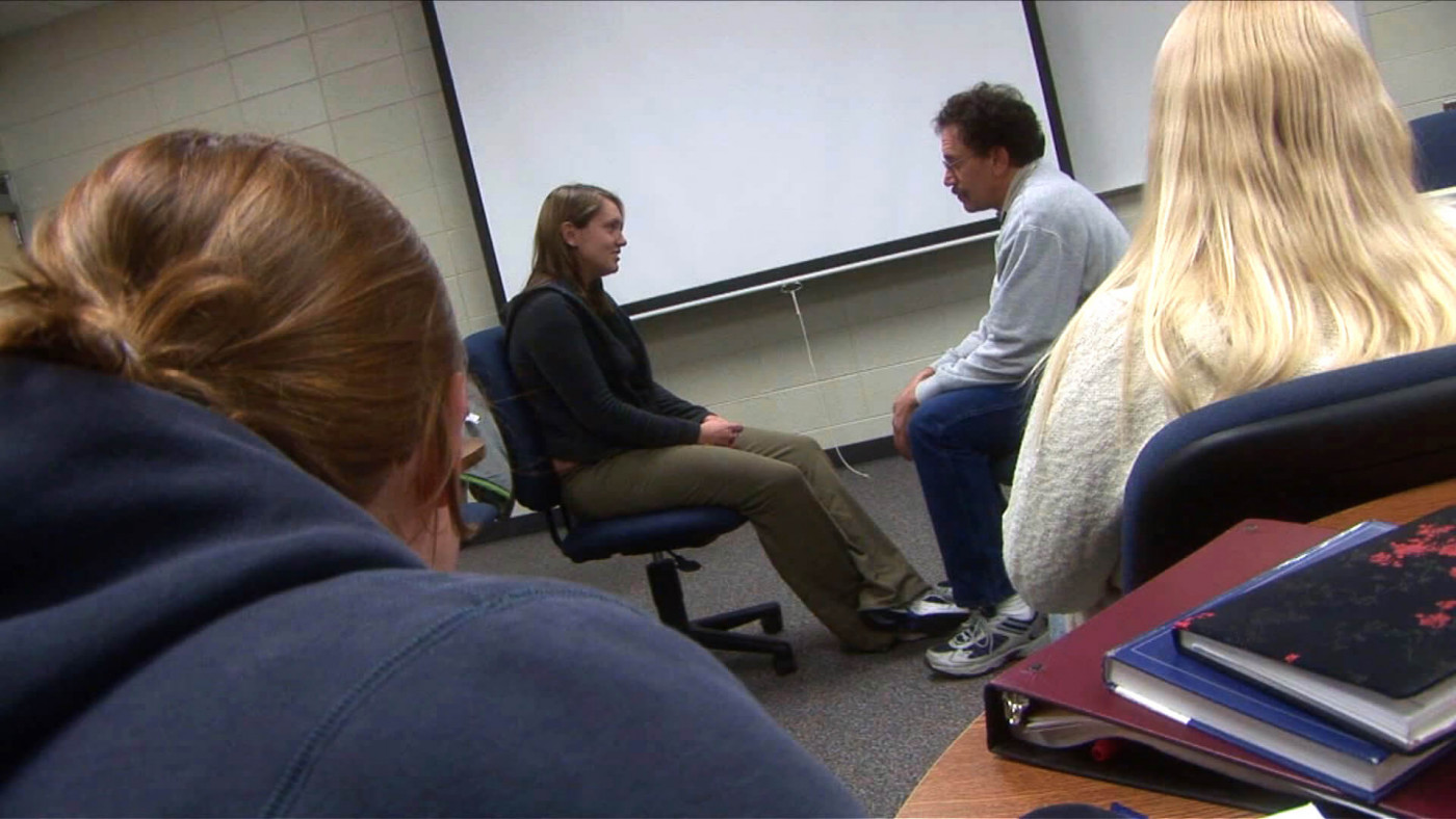 Students observing a simulated counseling session