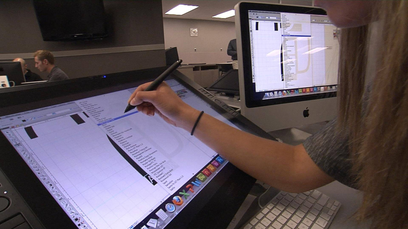 Student using a tablet for graphic design