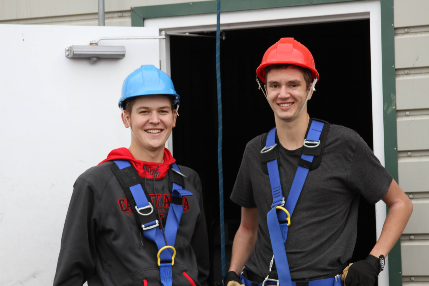 Students in safety harnesses